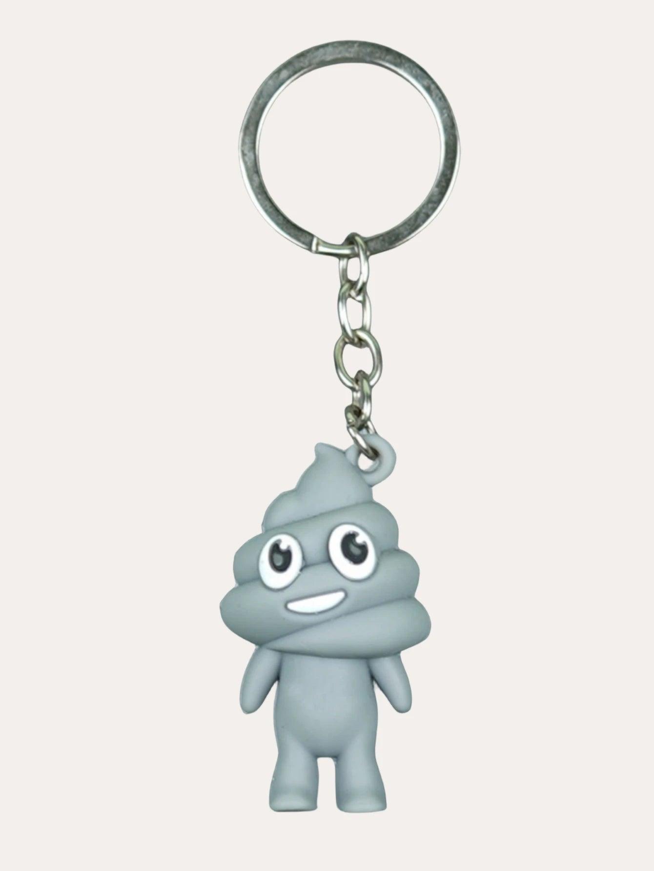 Gray poop emoji keychain with a happy expression on a metal keyring, against a plain background.