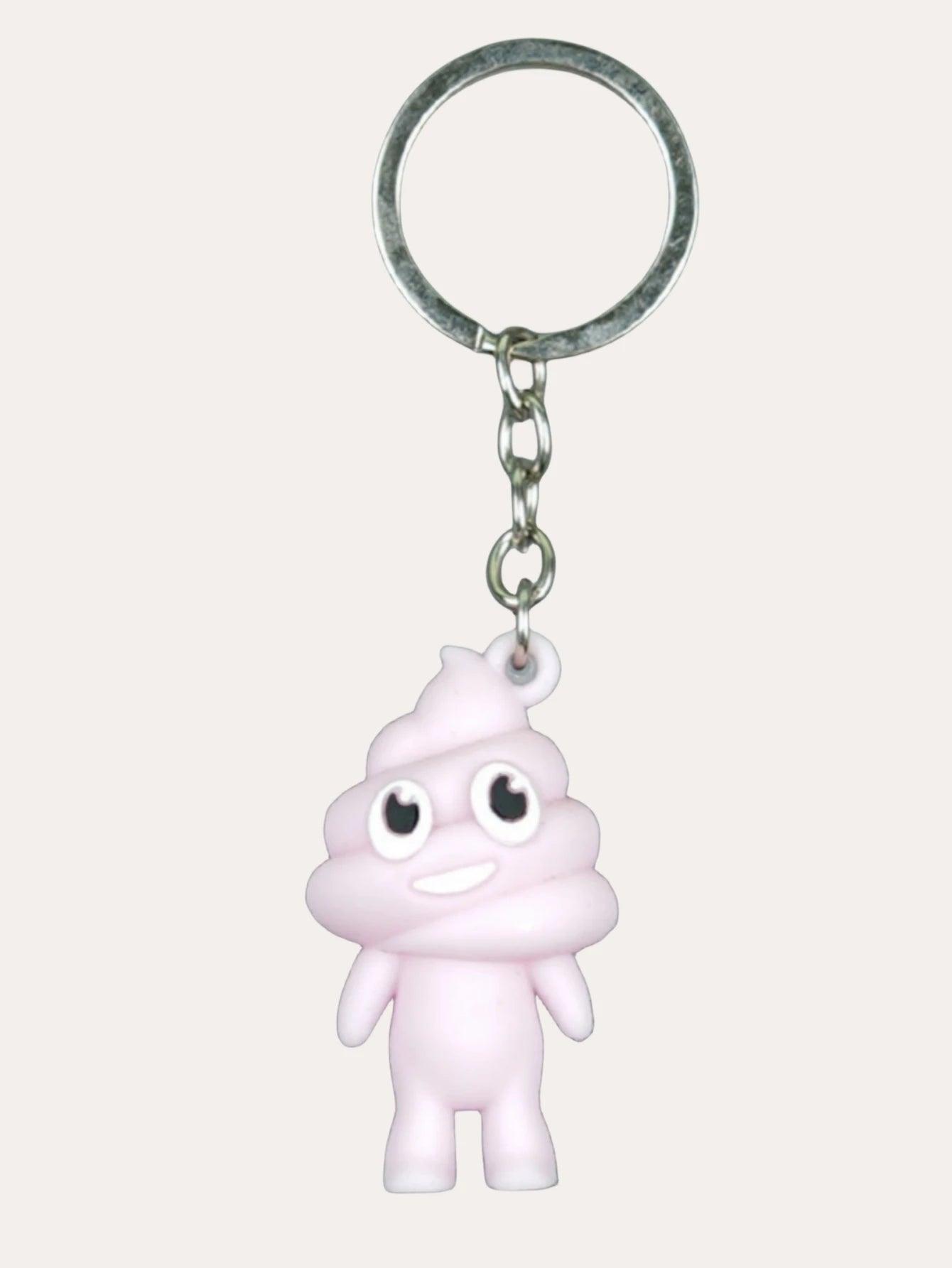 Pink poop emoji keychain with a cheerful face on a metal keyring, against a plain background