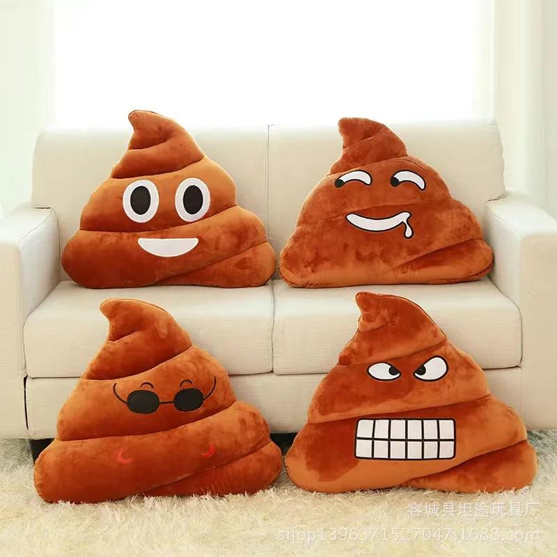Four poop emoji pillows on couch, brown plush with fun faces
