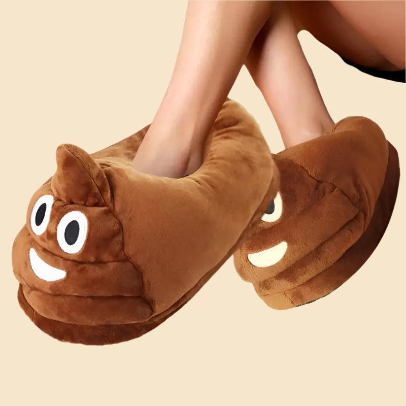 erson wearing brown poop emoji slippers for kids and adults, smiling design on a white background.