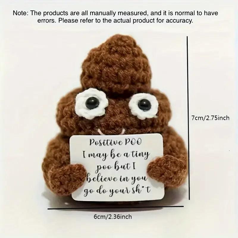 Positive Poop plush with a sign on a white surface, measured at 6cm and 7cm.