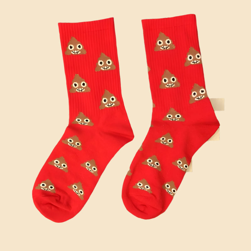 Red socks with poop character on them on a patterned background