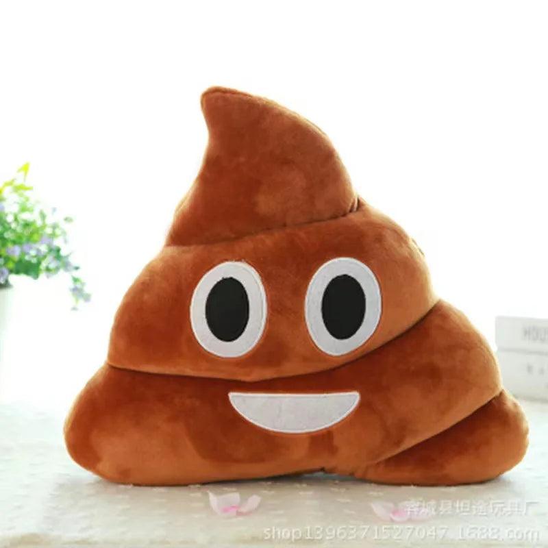 Plush smiling poop emoji pillow, brown with happy face, on a white surface.
